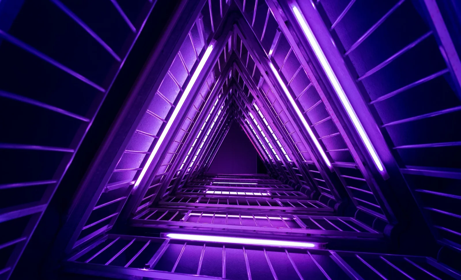 Purple illuminated geometric tunnel